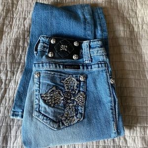 Miss Me boot cut jeans with embellishments on the pockets size 25